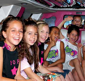 Girls having fun in a limo for kids birthday party