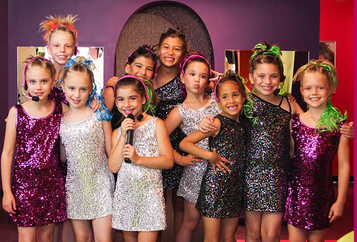 Group of ten girls dressed as rockstars for kids birthday party