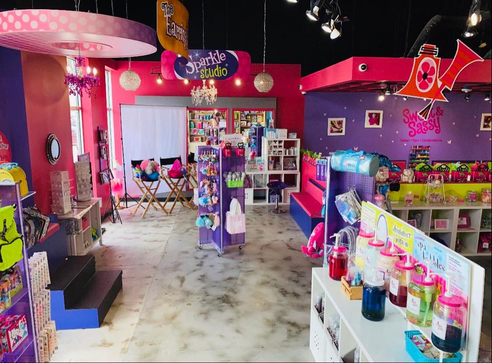 Toys and merchandise on display inside Sweet & Sassy kids salon